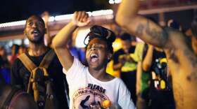 demonstrators-protest-the-death-of-michael-brown-on-friday-in-ferguson-mo-brown-was-shot-and-killed-by-a-ferguson-police-officer-on-august-9