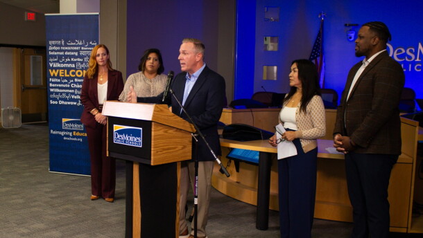 Members of the Des Moines School Board congratulate interim superintendent Matt Smith, who they just named permanent superintendent.