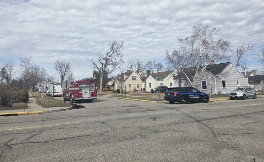 Emergency personnel form a perimeter around the 1500 block of Bixby Avenue Northeast in Bemidji following a fire on April 16, 2026.