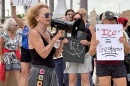 Legal observer June Sanson speaks to a crowd of approximately 150 people during the Ice Out Now protest in front of the Luminary Hotel in downtown Fort Myers in a effort to shine light on how ICE agents are staying in hotels to preform ICE activities throughout the community.