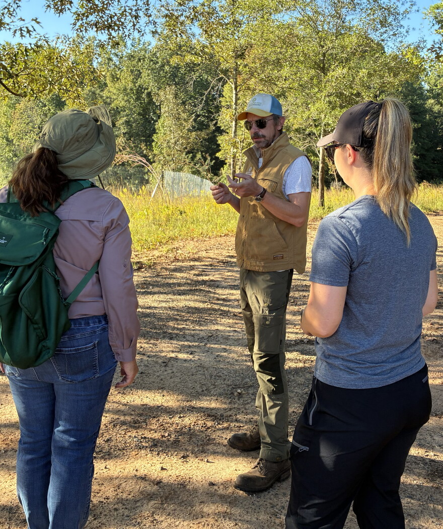 Anne Springs Close Greenway Natural Resources manager Eric Mischker gives volunteers the overview of what they're looking for among the tall grasses.