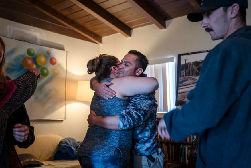 Cal Fire dispatcher Ali Wiseman and Captain Hiram Vazquez embrace during a healing session at a trauma retreat in Desert Hot Springs. 