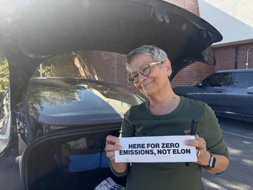 Cindy Ryan stands behind her 2025 Tesla Model 3 in Reno, Nevada, on Sept. 29, 2026.