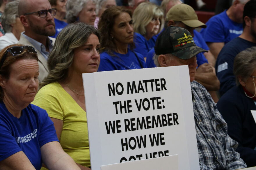 Dana Hanson, center, an organizer for We Are Mercer County, sits in the crowd listening to the Mercer County Fiscal Court during a Sept. 28 meeting.