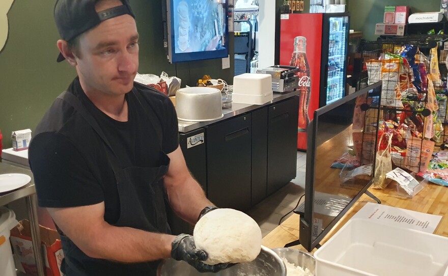 Trent mixes and works the dough before letting it rest and then shaping it into 60g dough balls to be rolled out and wrapped up.