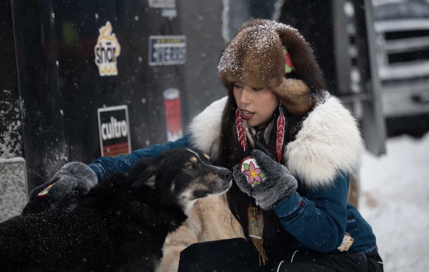 Quannah Chasinghorse checks out the dog teams at the Iditarod ceremonial start on Saturday. Her mother, Jody Potts-Joseph, is rookie in the race.