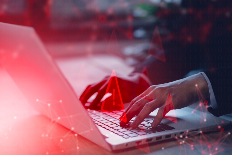 System hacked warning alert on notebook (Laptop). Cyber attack on computer network, Virus, Spyware, Malware or Malicious software. Cyber security and cybercrime. Compromised information internet.