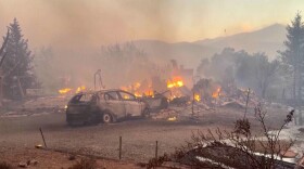 This image taken from video shows a charred neighborhood following wildfires Saturday, Aug. 22, 2026, in Reno, Nevada. (Tim Walton via AP)
