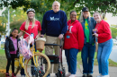 Mary Munford Elementary principal (center) Greg Muzik, flanked by students, parents and staff, at Walk, Bike, Roll to School Day