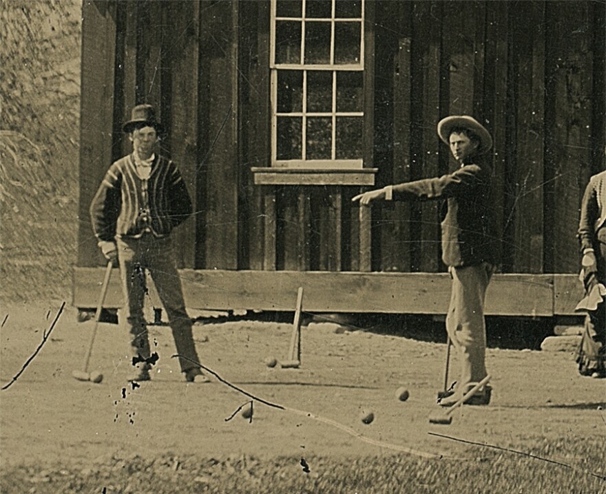 A detail of Billy the Kid (left) in the original tintype.