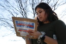 FILE - Karina Shumate, 21, a college student studying stenography, fills out a voter registration form in Richardson, Texas, on Jan. 18, 2020. Election vendors who print the ballots, registration forms and vote-by-mail cards used across the U.S. say their operations heading into the 2022 elections are running into the same delays and higher costs inflicting just about every industry since the pandemic began. (AP Photo/LM Otero, File)