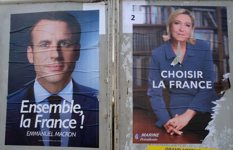 The election campaign posters of French presidential candidates Emmanuel Macron (left) and Marine Le Pen, ahead of the second and final round of the French presidential election on May 7. (Eric Cabanis/AFP/Getty Images)