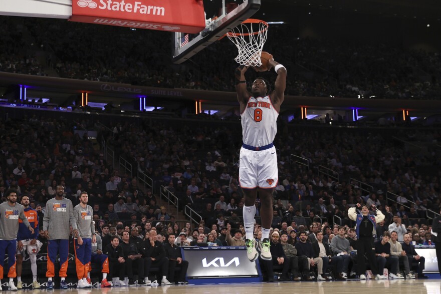 New York Knicks' OG Anunoby dunks the ball during the second half of an NBA basketball game against the Toronto Raptors Wednesday, Jan. 8, 2025, in New York. (AP Photo/Pamela Smith)