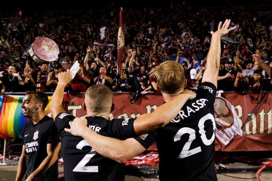 Sacramento Republic FC Players celebrate their US Open semifinal overtime win against Sporting Kansas City in Sacramento, Calif.