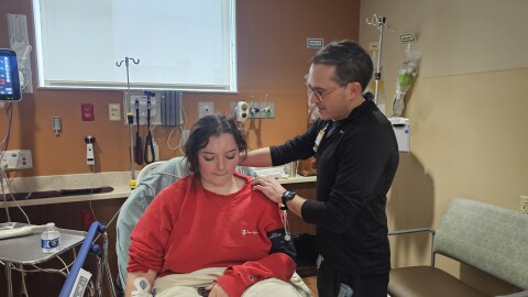 Mizzou's ER physiotherapist Marc Olive is examining a patient who has been in a car accident