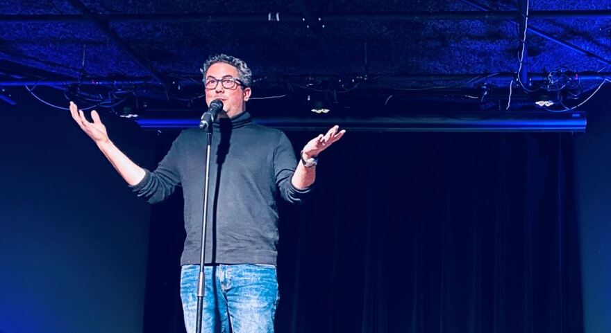 Duncan Craig telling a story about his mission to find his father's guitar.