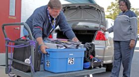 Peter Durand, an Alachua County election worker, packs voting materials at the warehouse where Alachua County votes are stored on Monday. The supplies will be distributed across the county voting precincts.