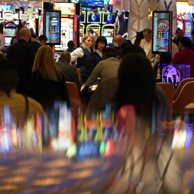 In this June 24, 2021 photo, visitors crowd the casino during the opening night of the Resorts World Las Vegas hotel-casino in Las Vegas.