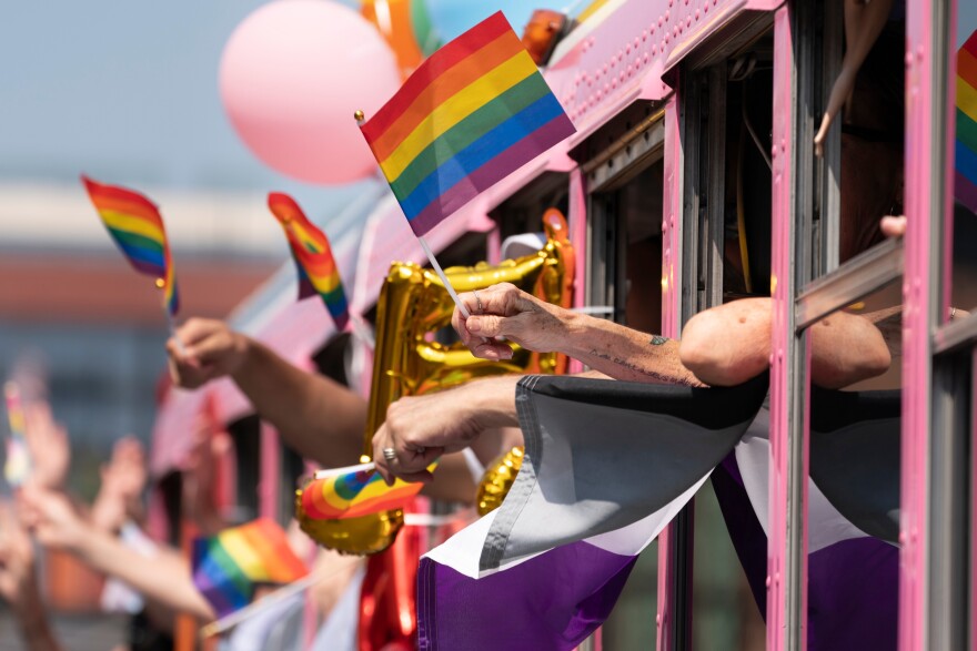 Parade participants wave to spectators during the Nashville Pride Parade Saturday, June 24, 2023, in Nashville, Tennessee.