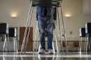 A voter fills out their Ohio primary election ballot at a polling location in Knox Presbyterian Church in Cincinnati, Ohio, on Tuesday, March 19, 2024.
