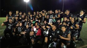 The Kapaʻa football team after winning the Division II state championship game on Dec. 30, 2021.