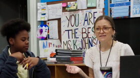 Tulsa Public Schools teacher Asriel Teegarden works on reading comprehension with a small group of students at Burroughs Elementary on Monday.