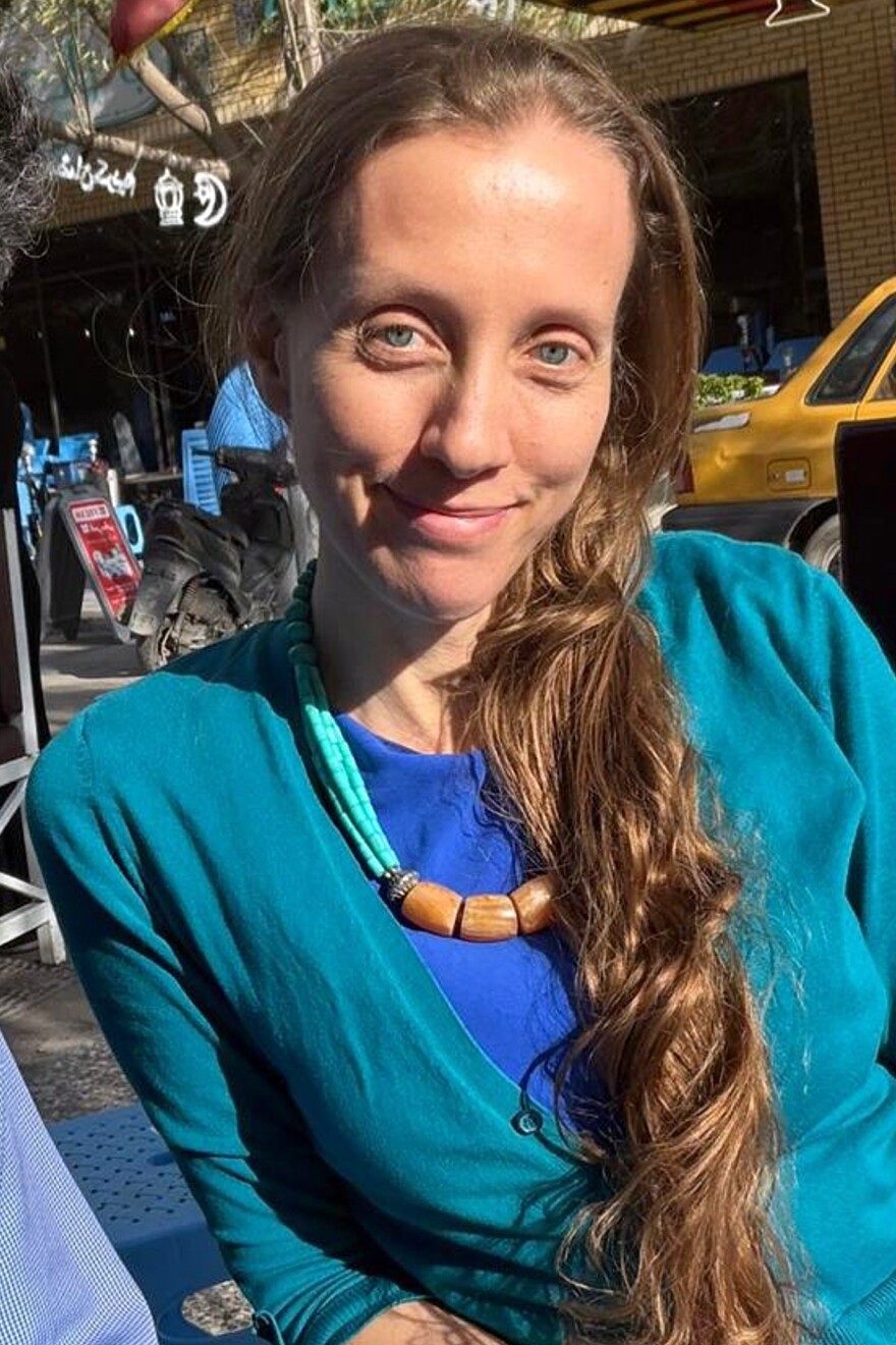 U.S. journalist Shelly Kittleson poses for a cellphone photo in a cafe in Baghdad, Iraq, Monday, March 30, 2026.