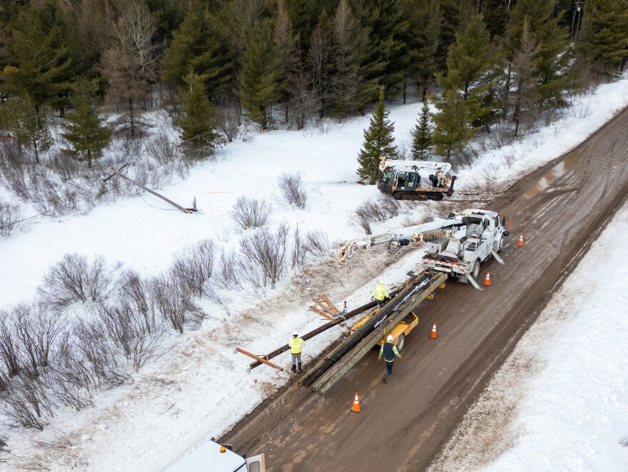 Cloverland Gas and Electric lineman work to fix fallen powerlines in Eastern UP after the 2026 blizzard.