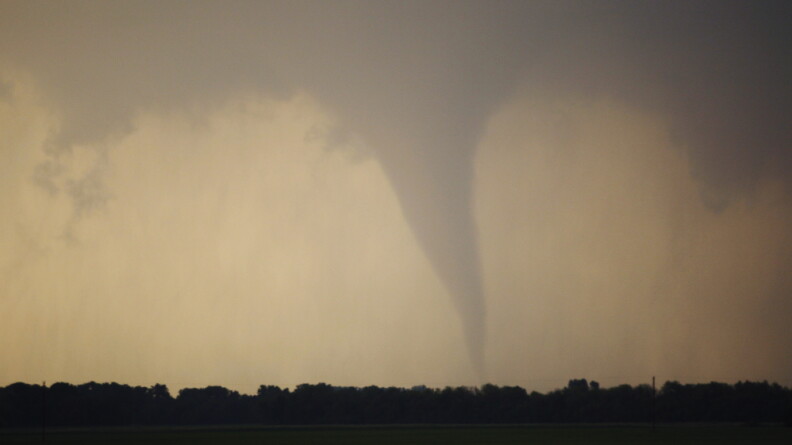 A tornado forms and touches down.