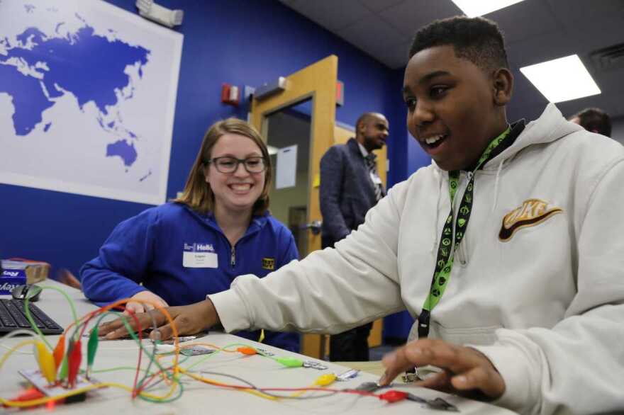 A teen learns about circuitry while building a game controller at the Best Buy Teen Tech Center in Indianapolis.