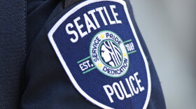 A Seattle Police Department patch is seen on an officer's uniform, July 17, 2016, in Seattle.