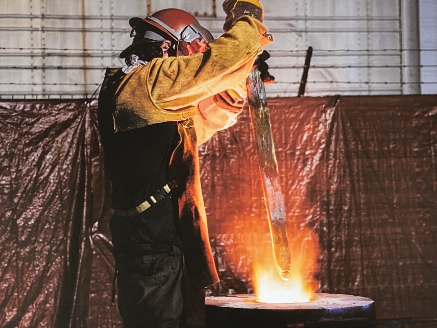 A foundry worker melts the bronze sword long held by a statue of Robert E. Lee in Charlotteville.