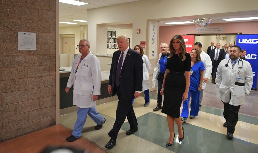 President Trump along with first lady Melania Trump visits the University Medical Center in Las Vegas on Wednesday to meet with medical staff and survivors of the mass shooting in the area.