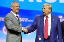 Donald Trump shakes hands with Robert F. Kennedy Jr. at a campaign rally in October.