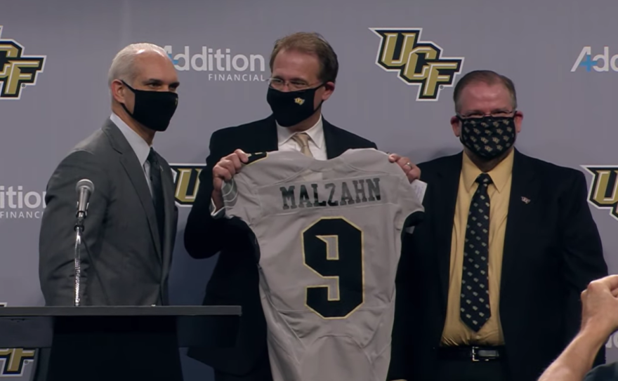 New UCF Athletics Director Terry Mohajir, with new head coach for the UCF Knights Gus Malzahn, and UCF President Alexander Cartwright at a press conference Monday. // Source: YouTube.