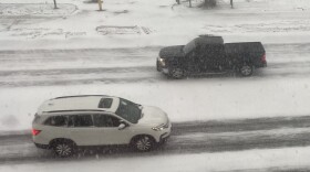 Cars navigate State Street on Monday, Dec. 29, 2025, as snow blows, affecting visibility.