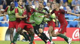 Portugal players celebrate after Eder (center) scored the winning goal during the Euro 2016 final soccer match between Portugal and France in Saint-Denis, north of Paris, on Sunday.