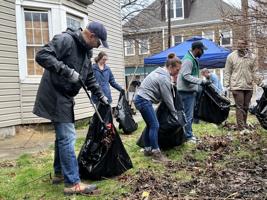 Slavic Village residents and business owners clean up a problem property on the corner of E. 65th Street and Sebert Avenue in Slavic Village.