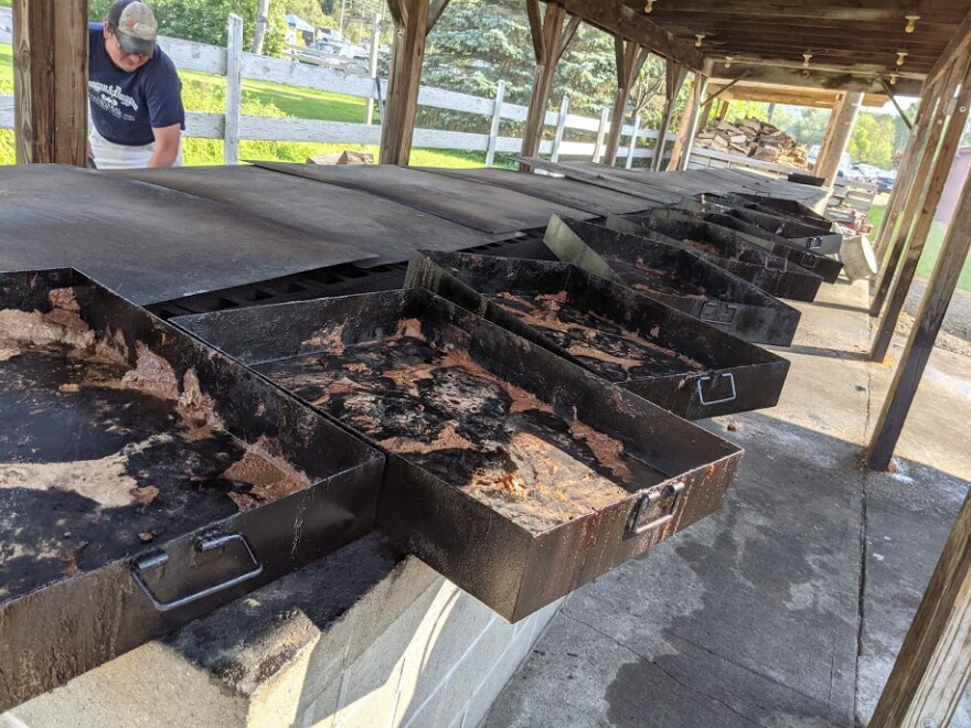 A row of black drawers used to grill thousands of pounds of rodeo barbeque