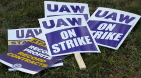 FILE - United Auto Workers signs for a strike are shown at the Stellantis Sterling Heights Assembly Plant, in Sterling Heights, Mich., Monday, Oct. 23, 2023. Jeep maker Stellantis has reached a tentative contract agreement with the United Auto Workers union that follows a template set earlier this week by Ford, two people with knowledge of the negotiations said Saturday, Oct. 28, 2023.