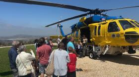 Visitors at the Ronald Reagan Presidential Library visit a Ventura County Air Unit helicopter during a wildfire awarness event.