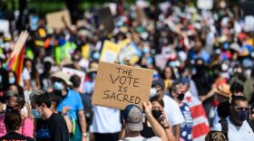 Protesters rally to demand protection for voting rights on the 58th anniversary of the 1963 March on Washington for Jobs and Freedom, in Washington, DC.