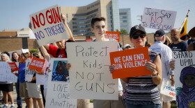 Demonstrators gather to protest the arrival of President Donald Trump outside Miami Valley Hospital after a mass shooting that occurred in the Oregon District early Sunday morning, Wednesday, Aug. 7, 2019, in Dayton. (John Minchillo/AP)