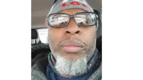 Juan Ruffin Sr., a butcher at Kroger, talks about his life a year into the pandemic.