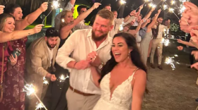 Aric Hutchinson and Samantha Miller are pictured at their wedding on Friday in a photo on a GoFundMe page. They were traveling in a golf cart hours later when a driver struck, killing Miller and injuring Hutchinson and two others.