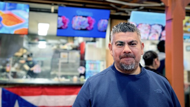 Enrique Rodrigez of Amston, a neighborhood in Hebron, CT, stands in front of Mofongo inside Parkville Market in Hartford, Connecticut on November 10th 2025. He owns the Puerto Rican eatery, as well as Fowl Play. He also opened Las Tortas MX and Burrito Loko inside the marketplace. Rodriguez said he covers the cost of tariffs so his customers don't have to. “For now, we want to take care of the people,” Rodriguez said.