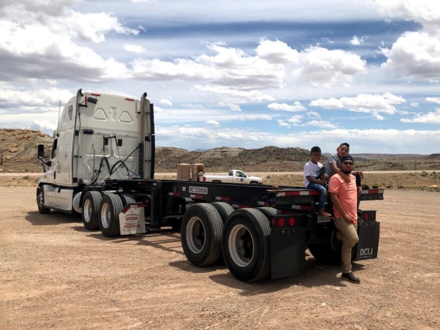 Neftali Dubon, a truck driver at the ports of Los Angeles and Long Beach, says he needs at least five or six runs a day to make a living. He's now doing one or two. As an owner-operator, he still has to keep paying down a loan on his rig.
