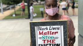 Stephanie Wilder of Durham takes part in protest against evictions outside the Durham County Courthouse. She fears eviction.