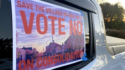 A "Vote no on consolidation" outside of the New Paltz Community Center