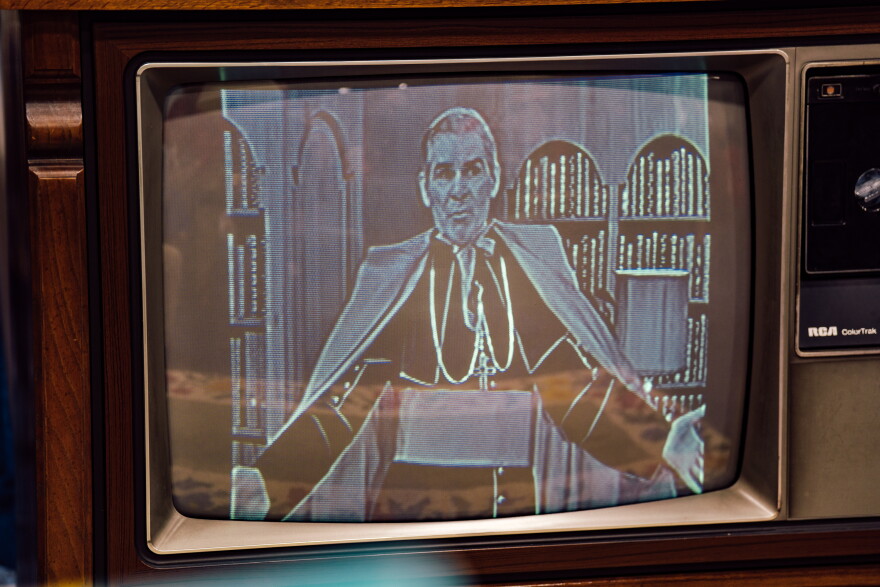 Archival footage of the late Archbishop Fulton J. Sheen plays on an RCA ColorTrak television during an expo ahead of his beatification Mass on Thursday.